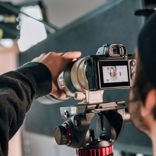 selective-focus-of-videographer-filming-woman-in-p-2022-12-16-17-39-35-utc